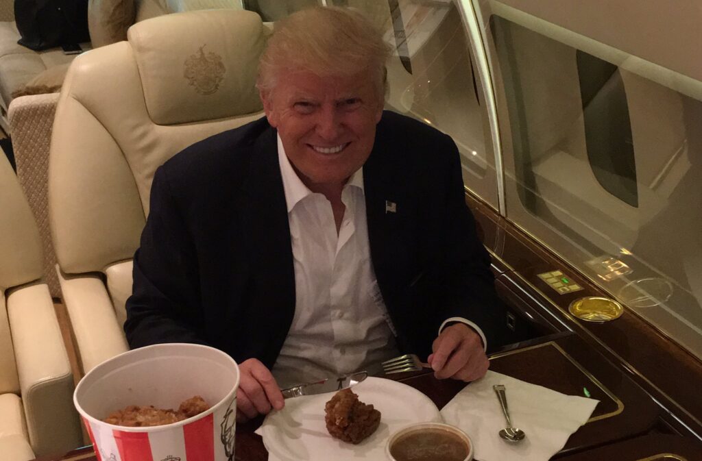 Donald Trump eating chicken. Bawk!